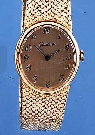 GLASHÜTTE SCHMUCKBANDUHR, MEDIUMGRößE, ME- TALLOVALGEH., INCL. BAND HARTVERG., EDELST.- BODEN AUFGEDR., ARMBANDUHRFORMWERK DER GUB, BASISKAL. ...