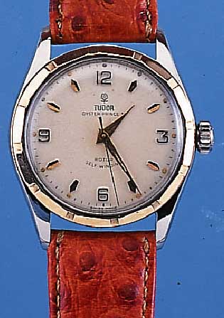 TUDOR HERRENARMBANDUHR OYSTER PRINCE, REF.- NR. 7909, SCHWEIZ UM 1952, EDELST. POL., BODENU. KRONE GESCHR., PRINZIP ROLEX, GG-LüNETTE, VERS. ...