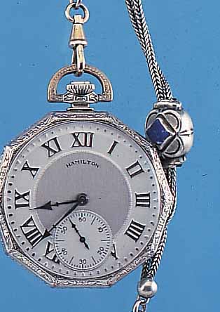 HAMILTON HERRENTASCHENUHR LEPINE, REF.-NR. 0233516, USA UM 1924, WG-FILLED GEH. IN 8- ECKFORM, RAND WIE PENDANT U. BüGEL RELIEFIERT,AUF BODEN ...