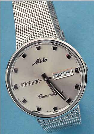 MIDO HERRENARMBANDUHR COMMANDER, REF.-NR. 636-8429, SCHWEIZ UM 1995, EDELST.-EINSCHALEN-GEH., EDELST.-FLECHTBAND, STILTYP. UM 1964, ORIG.-ETUI, ...