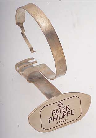 PATEK PHILIPPE DEKORATIONSUHRENSTäNDER, UM 1955, METALL VERS., ALTERSBED. FARBL. GET.,BESTELL-NR. 517