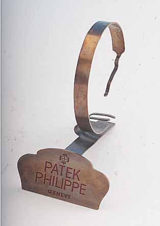 PATEK PHILIPPE DEKORATIONSUHRENSTäNDER, UM 1955, METALL VERS., ALTERSBED. FARBL. GET.,BESTELL-NR. 524