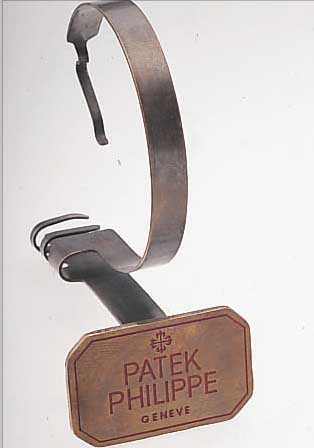 PATEK PHILIPPE DEKORATIONSUHRENSTäNDER, UM 1955, METALL VERS., ALTERSBED. FARBL. GET.,BESTELL-NR. 512