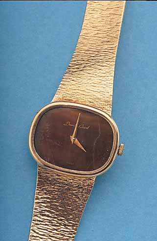 BUECHE GIRORD HERRENARMBANDUHR, ENGL. 9 KT ROSE-G-GEH., INCL. BAND, BODEN AUFGEDR., MINE-RALFLACHGLAS, TIGERAUGEZIFFERBL. (HAARRIS.), ...