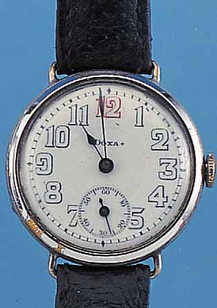 DOXA HERRENARMBANDUHR, REF.-NR. 1052557, SCHWEIZ UM 1920, NICKEL, SCHARNIERBODEN, LüNETTE MESSING VERCHR., ERS., PERF. EMAILBL.,SIGN., ROTE ...