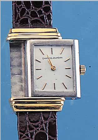CHARLES JOURDAN HERRENARMBANDUHR, REF.-NR. 1654, SCHWEIZ/FRANKREICH UM 1974, METALL WENDEGEH., ZU DEN BANDANST. HART ROTVERG., EDELST., ...
