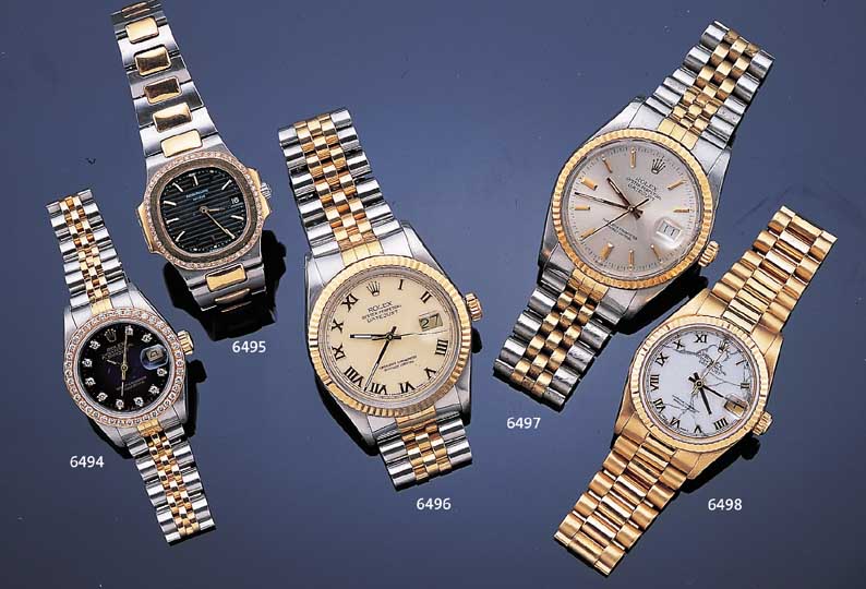 PATEK PHILIPPE DAMENARMBANDUHR NAUTILUS, SCHWEIZ UM 1987, EDELST./GG 750/000-EINSCHA- LENGEH., HIGH-TECH-QUARTZWERK M. DATUM, MAS- SIV ...
