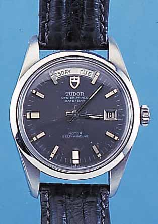 TUDOR HERRENARMBANDUHR DATE-DAY, REF.-NR. 682304/3017/0, SCHWEIZ UM 1969, EDELST., GEH. BAUWEISE ROLEX, BODEN U. KRONE GESCHR., ETUI, NEUTR. ...