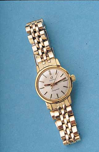 OMEGA DAMENARMBANDUHR LADYMATIC, REF.-NR. 565-002, SCHWEIZ UM 1965, METALL HARTVERG., EDELST.-BODEN GESCHR., EDELST.-ORIG.-BAND M. GOLDAUFL., ...