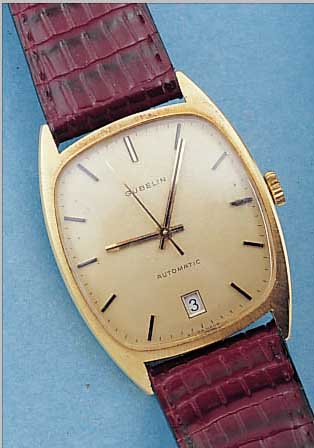 GUBELIN HERRENARMBANDUHR AUTOMATIK, REF.-NR.2409, SCHWEIZ UM 1969, GG 750/000, BODEN GE- DR., DATUM BEI 6, 21 ST., ZENTRALROTOR KUGEL- GEL., ...