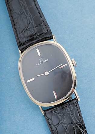 MOVADO HERRENARMBANDUHR, SCHWEIZ/USA UM 1965, WG 585/000, BODEN GEDR., RUNDANKERW., 17 ST., HANDAUFZUGKAL. 1731, GLYC.-UNR., FLACHSPIR., ...