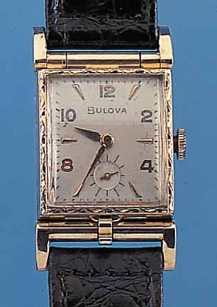 BULOVA HERRENARMBANDUHR SOGENANNTE PICTURES- WATCH, WERK M. ÜBERGEH. AUFKLAPPBAR, DARUN- TER RAHMEN ZUM EINLEGEN EINES FOTOS, USA UM 1942, ...