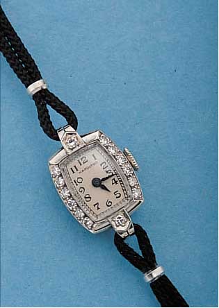 HAMILTON DAMENSCHMUCKUHR, REF.-NR. A0986, USA UM 1948, WG 585/000, LüNETTE U. KORDEL- BANDANST. M. 8/8 DIAMANTEN ZUS. CA. 0,15 CT, M. L. ...