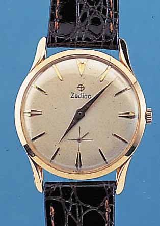 ZODIAC HERRENARMBANDUHR, GG 750/000, FLACHE AUSF., VERS. BLATT ALTERSB. L. FLECK., ERHAB. GOLDSTD.-ZEICH., KL. SEK., ANKERRUNDWERK, ...