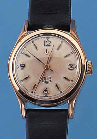 GUB HERRENARMBANDUHR GüTEKLASSE, REF.-NR. 8105, DEUTSCHLAND UM 1951, METALL ROTVERG., BER., EDELST.-BODEN GESCHR., AUßER LEDERB. ...