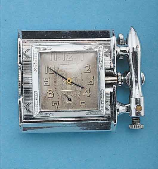 NOIRET BENZINFEUERZEUG M., EINGEBAUTER UHR, SCHWEIZ UM 1930, METALL VERCHR., FKT.-FäHIG, RUNDANKERW., ZIFFERBL. ALTERSBED. FARBL. GET.,6 ST., ...
