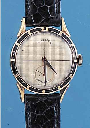 LORD ELGIN HERRENARMBANDUHR SHOCKMASTER, USA UM 1955, GG-FILLED, STD.-ZEICHEN AUF LüNE-TTE, FORMANKERW., 21 ST., HANDAUFZUGKAL. 713, SCHR.-UNR., ...