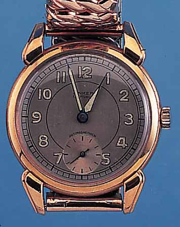 HANHART HERRENARMBANDUHR, DEUTSCHLAND UM 1940, METALL VERG., BET. BANDANST., EDELST.- BODEN GEDR., SCHERENZUGGLIEDERB. SPäTER, VERS.BLATT, ...