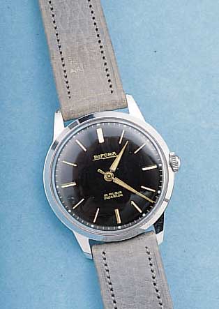 BIFORA HERRENARMBANDUHR UNIMA, DEUTSCHLAND UM 1958, METALL HARTVERCHR., EDELST.-BODEN GESCHR., UNGETR. LAGERW. M. ZEITIDENT. LEDER- B., ...