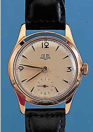 GUB HERRENARMBANDUHR, REF.-NR. 050470, DEUTSCHLAND UM 1955, METALL ROSEVERG., EDEL- ST.-SCHR.-BODEN, GUILL. U. CREMEFARB. LACKIER-TES BLATT, ...