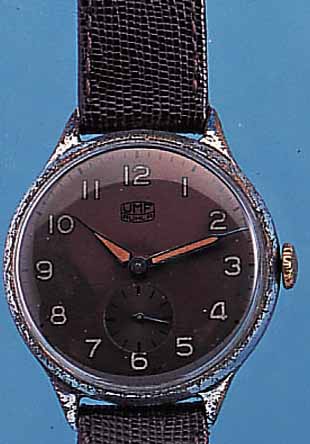 UMF/RUHLA HERRENARMBANDUHR, REF.-NR. 37/268/0004, DEUTSCHLAND UM 1955, METALL VERCHR., BERIEB., EDELST.-BOD. U. GLASR. ...