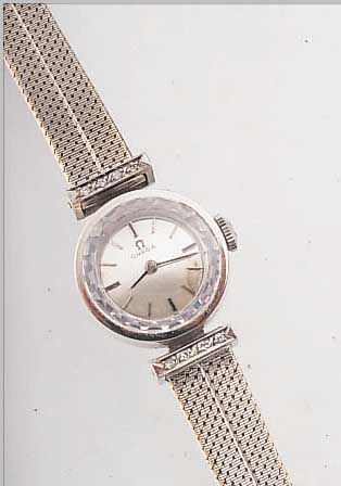 OMEGA DAMENSCHMUCKUHR, REF.-NR. 10987/61, SCHWEIZ UM 1962, WG 750/000 INCL. NEUTR. WG- BAND, BANDANST. M. DIAMANTBES., GLASR. GEDR., BOMB. ...