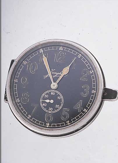 JUNGHANS EINBAUBORDUHR, DEUTSCHLAND UM 1939,BAKELITGEH., AUFZUG U. ZEIGERST. RüCKS., AUF- KLAPPB., KAL. J30D, EINBAUD. CA. 55 MM, NUTZ- SP., ...