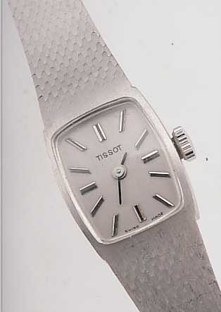 TISSOT DAMENGOLDBANDUHR, REF.-NR. 6753, SCHWEIZ UM 1968, WG 585/000 RHOD., BODEN GEDR., VERS. BLATT, FORMANKERW., 17 ST., ...