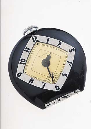 NEW HEAVEN TASCHEN/TISCHüHRCHEN, USA UM 1940HUFEISENFORM AUFSTELLBAR, ART DECO, METALL SCHW. LACKIERT, NUTZSP., STIFTENANKERW. M. ...