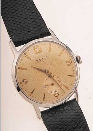 ETERNA HERRENARMBANDUHR ANTIMAGNETIK, SCHWEIZ UM 1953, EDELST., BODEN GESCHR., ORIG.-BLATT ALTERSBED. FARBL. GET., HANDAUFZUGKAL. 1274, ...