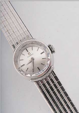 OMEGA DAMENGOLDBANDUHR, REF.-NR. 477704, SCHWEIZ UM 1962, WG 750/000 INCL. WG-BAND, ORIG.-ETUI, GARANTIEKARTE M. HERKUNFTSNACHW., BODEN GEDR., ...
