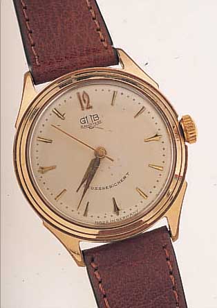 GUB HERRENARMBANDUHR, REF.-NR. 220525, DEUTSCHLAND UM 1958, METALL VERG., BER., EDELST.-SCHR.-BODEN, INDIR. ZENTRALSEK., 16 ST., ...