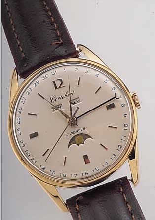 HERRENARMBANDUHR VOLLKALENDER, SCHWEIZ UM 1956, METALL NACHVERG., EDELST.-BODEN U. GLAS-R. GEDR., BLATT REST., BEZ. CORTEBERT (WOHL FEHLDRUCK), ...