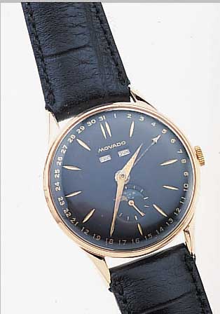 DAMAS HERRENARMBANDUHR VOLLKALENDER, REF.- NR. 3921, SCHWEIZ UM 1954, METALL ROSE NACH- VERG., EDELST.-BODEN U. GLASR. GEDR., KORREK- TURDR. ...