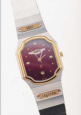 ASTON MARTIN DAMENARMBANDUHR LAGONDA, REF.- NR. 0857, SCHWEIZ UM 1990, EDELST. SAT., SA- PHIRFLACHGL., LüNETTE, KRONE SOWIE SCHILDER IN GG, ...