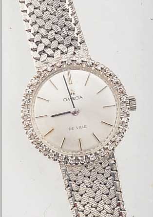 OMEGA DAMENGOLDBANDUHR DE VILLE, SCHWEIZ UM 1968, NEUTR. WG 750/000-RUNDGEH. INCL. WG- BAND RHOD., LüNETTE AUFWEND. M. 20 8/8 DIAMAN-TEN ZUS. ...