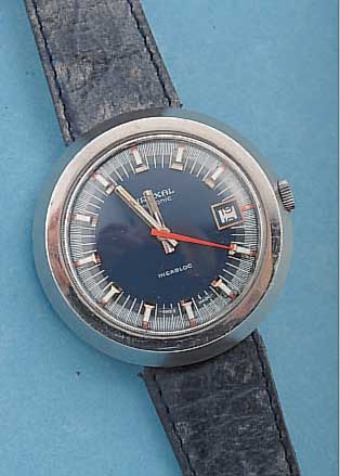 MIREXAL HERRENARMBANDUHR ELECTRONIC, REF.- NR. C750487, SCHWEIZ UM 1970, MASSIV EDEL- STAHL, BOD. AUFGEDR., BEI FERT.-STELL. WASSER-G., ...