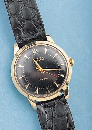 JORINA HERRENARMBANDUHR CHRONOMETER, REF.- NR. 2541, SCHWEIZ UM 1958, EDELST., STARKE GG-SCHULTERN, GG-LüNETTE, 17 ST., HANDAUFZUG, KAL. ETA ...