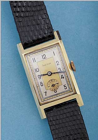 ARCTOS HERRENARMBANDUHR, REF.-NR. 186342, DEUTSCHLAND UM 1937, GG 585/000, RECT.-FORM, BODENSCHARNIER, 2-FARB. ORIG.-BLATT, GEBL. STAHLZEIGER, ...
