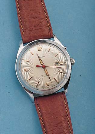 ESKA HERRENARMBANDUHR AUTOMATIK, REF.-NR. 19005, SCHWEIZ UM 1955, METALL VERCHR., EDELST.-BODEN GESCHR., GUILL. U. VERS. BLATT, DATUM M. ...