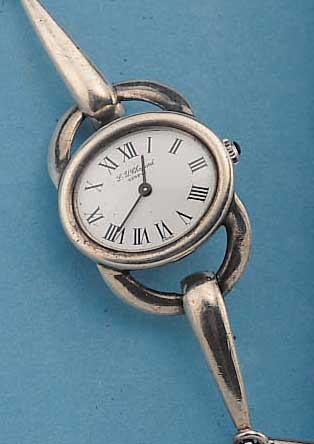 CHOPARD DAMENARMBANDUHR, SCHWEIZ UM 1970, 925ER SILBER, SILBERBAND MASSIV VERARB. IN FORM EINER TRENSE, BODEN GEDR., EMAILFARB. BLATT, ...