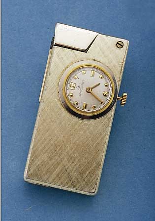 SWISSAM BENZINFEUERZEUG M. EINGEBAUTER UHR, ELOXIERTES ALUMINIUM, MAßE CA. 60 X 28 X 12 MM, STIFTENANKERRUNDW., GEHFäHIG/INTAKT, GLAS FEIN ...