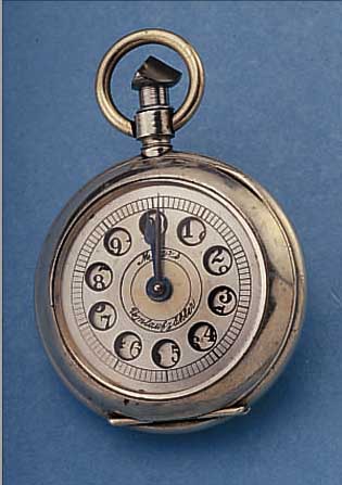 UMLAUFZäHLER VON MAYS, DEUTSCHLAND UM 1930, NICKELGEH. IN FORM EINER TASCHENUHR, ANSCHLUß DREIECK IN BüGELBER., DEZIMALTEILUNG, MASSIV ...