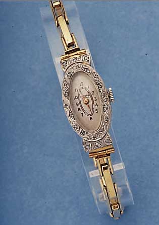 ANCORA ART-DECO DAMENARMBANDUHR, 750/000 GG U. WG-OVALGEH., DIAM.-ROSEN AUF LüN. U. BANDANST., ZEITIDENT. 9 KT ROSE-G-ZUGGLIED.- BAND., ...