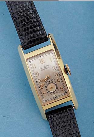 GRUEN CURVEX ARMBANDUHR, SCHWEIZ/USA UM 1940, GG-FILLED, GEZ. RECT.-FORM IN SICH EXTREM GEW., MAßE CA. 42 X 20 MM, LEDERB. NEU,BODEN ...