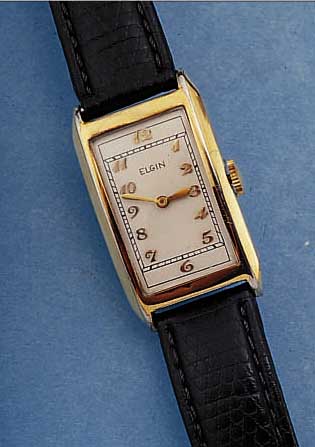 ELGIN HERRENARMBANDUHR, USA UM 1936, GG- FILLED, RECT.-FORM, BODEN GEDR., BLATT VERS., FORMANKERW. IN MASSIVBAUW., 7 ST., KOMP.-UNR.,BREG.-SPIR., ...