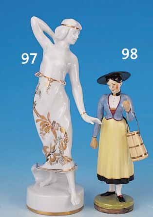 PORZELLANFIGUR, NYMPHENBURG, UM 1860, FRAU IN TRACHT MIT FASS, BUNTE BEMALUNG, H. 16,5CM,L. REST.