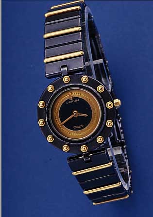 CORUM DAMENARMBANDUHR CLIPPER-CLUB, SCHWEIZUM 1988, EDELSTAHL, DUNKEL VERCHROMT, INCL. EDELSTAHLBAND M. UNSICHTB. FALTSCHL., ZWISCHENGL. ...