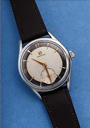 OMEGA HERRENARMBANDUHR, REF.-NR. 2891/1, SCHWEIZ UM 1957, EDELST., BODEN GEDR., 2-FARB.ORIG.-BLATT ALTERSBED. FL., VERG. ANKERW., ...