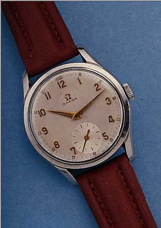 OMEGA HERRENARMBANDUHR, REF.-NR. 2639/13, SCHWEIZ UM 1953, EDELST., VERS. BLATT, ALTERSBED. FL., AUFGES. GOLD-STD.-ZEICHEN, 17 ST., RUNDANKERW. ...